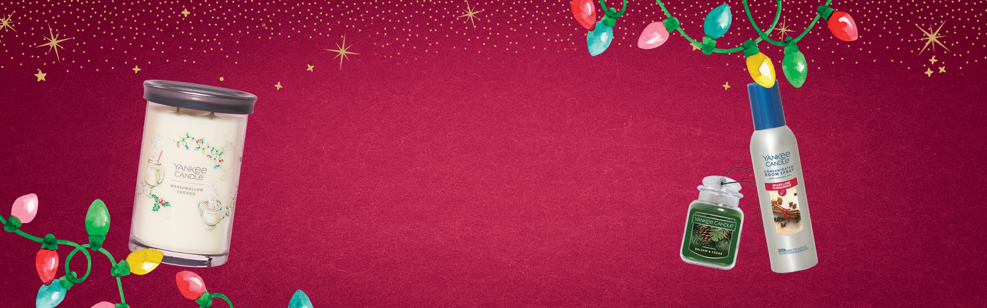 dark pink holiday background with assorted festive yankee candle products