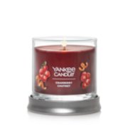 burning cranberry chutney small signature candle on lid tray image number 1