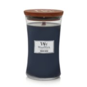 hourglass shaped candle in indigo suede scent