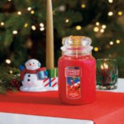 christmas eve large jar candle and bayberry taper candle on holder and votive candle with votive holder on table image number 2