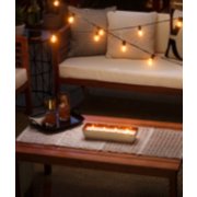 cocowater citronella outdoor candle on table image number 4