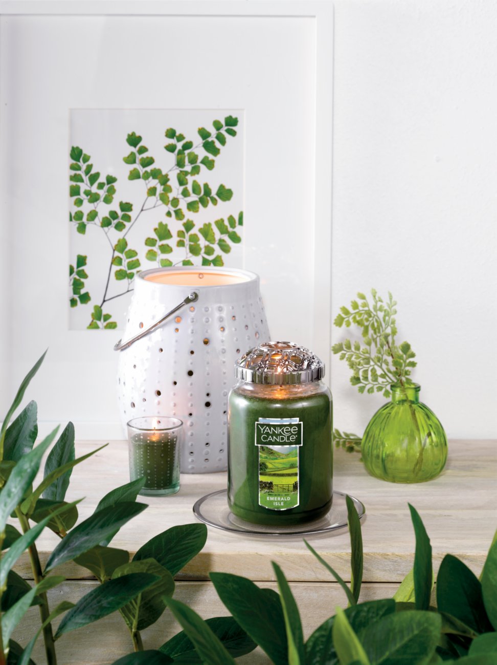 emerald isle large jar candle with illuma lid on tray with votive candle on votive holder and jar candle holder