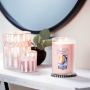 tangerine and vanilla large 2 wick tumbler candle on tray and jar holder and tea light votive holder on table image number 3