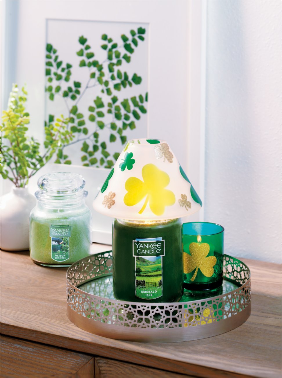 emerald isle and meadow showers large and medium jar candle and tea light with holder and votive holder and tray on table