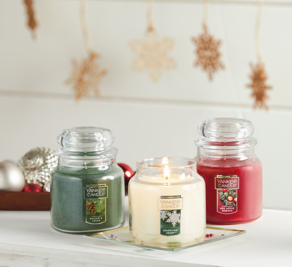 balsam and cedar, sparkling snow, and red apple wreath original small jar candles on table