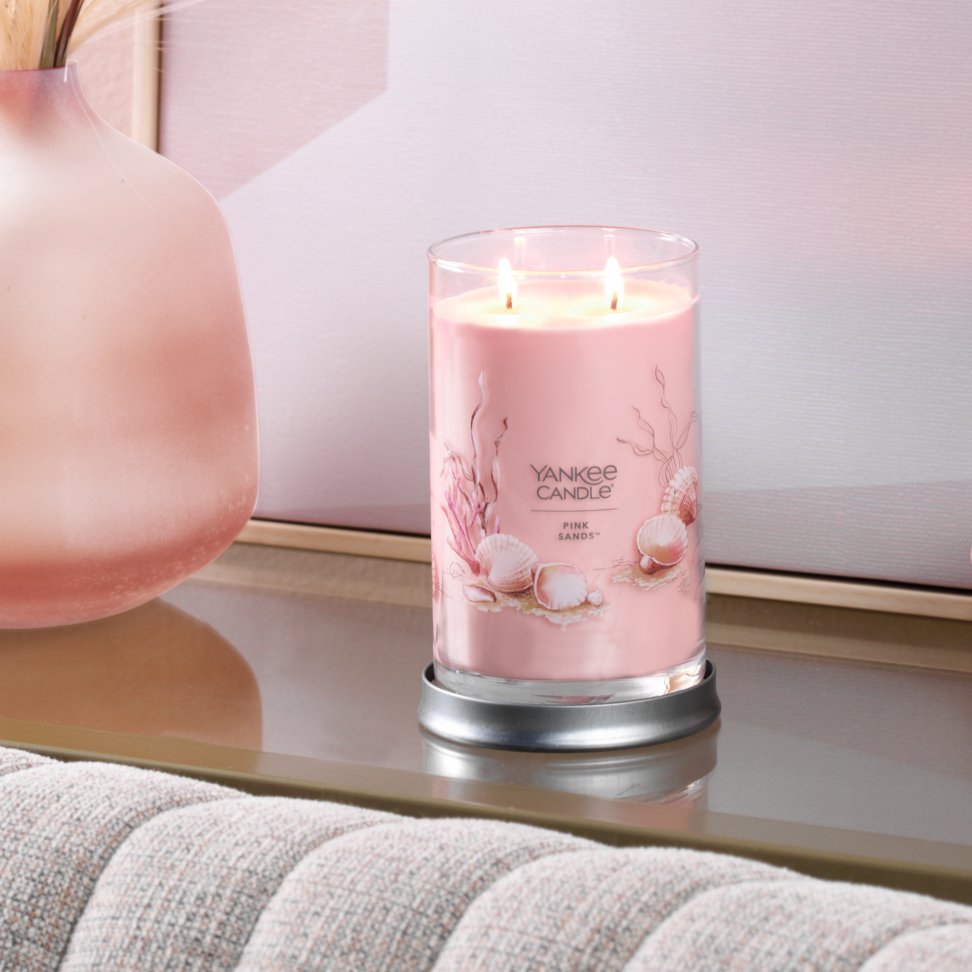 pink sands signature large tumbler candle on table