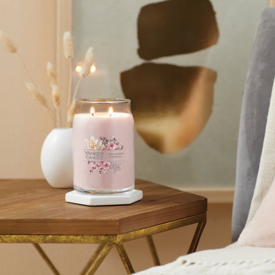 pink cherry and vanilla signature large jar candle on table