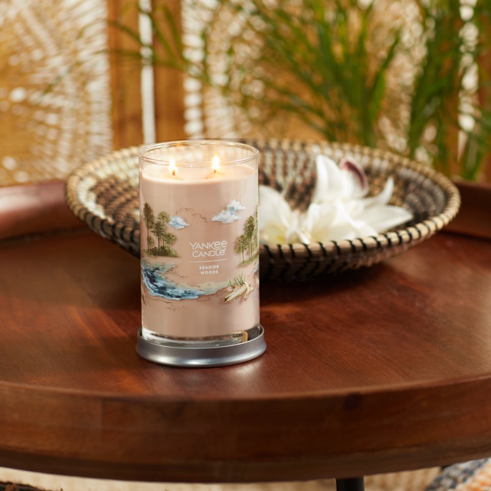 seaside woods signature large tumbler candle on table