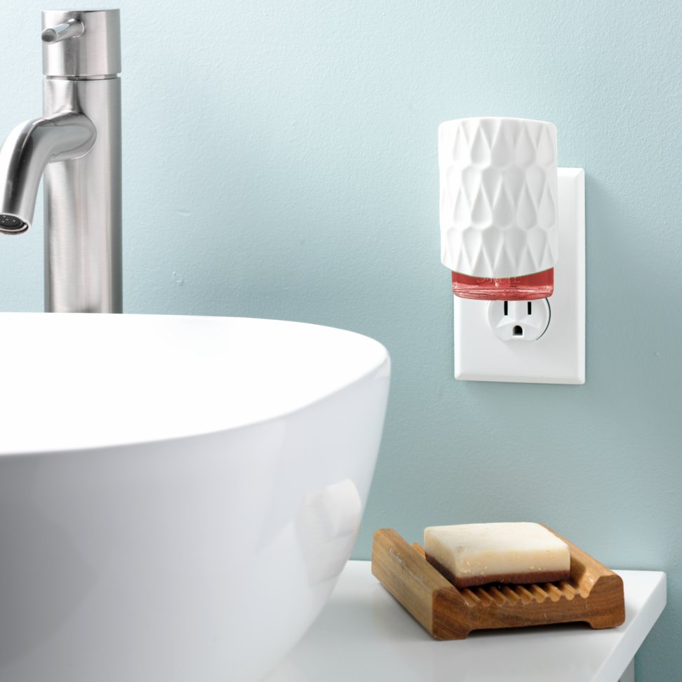 organic pattern scentplug diffuser plugged into bathroom outlet