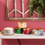 cuddled up, balsam and cedar, christmas cookie, red apple wreath, and sparkling snow three-wick candles image number 3