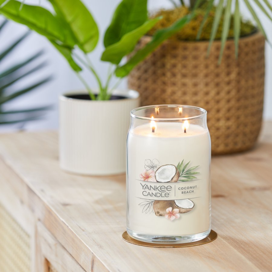 coconut beach signature large jar candle on table