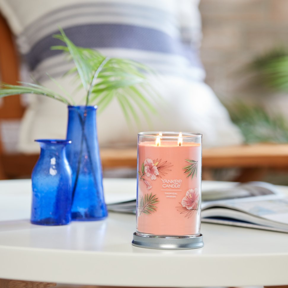 tropical breeze signature large tumbler candle on table