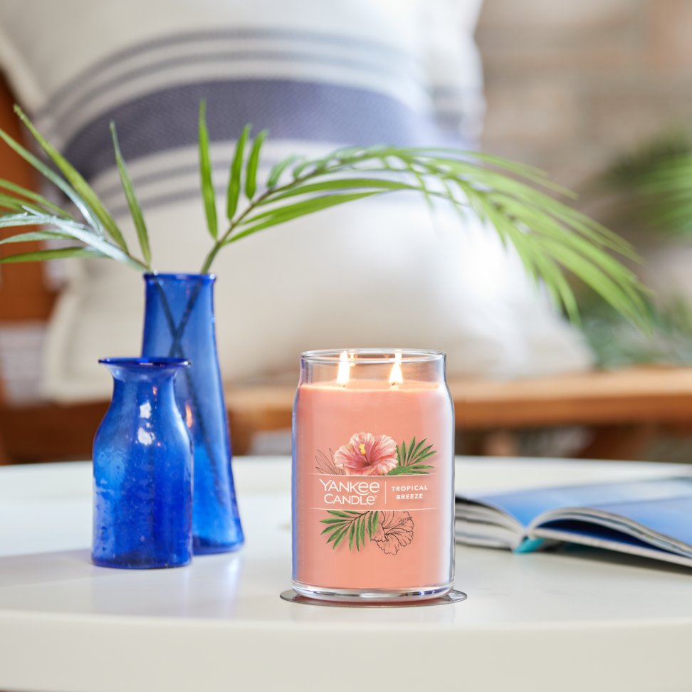 tropical breeze signature large jar candle on table