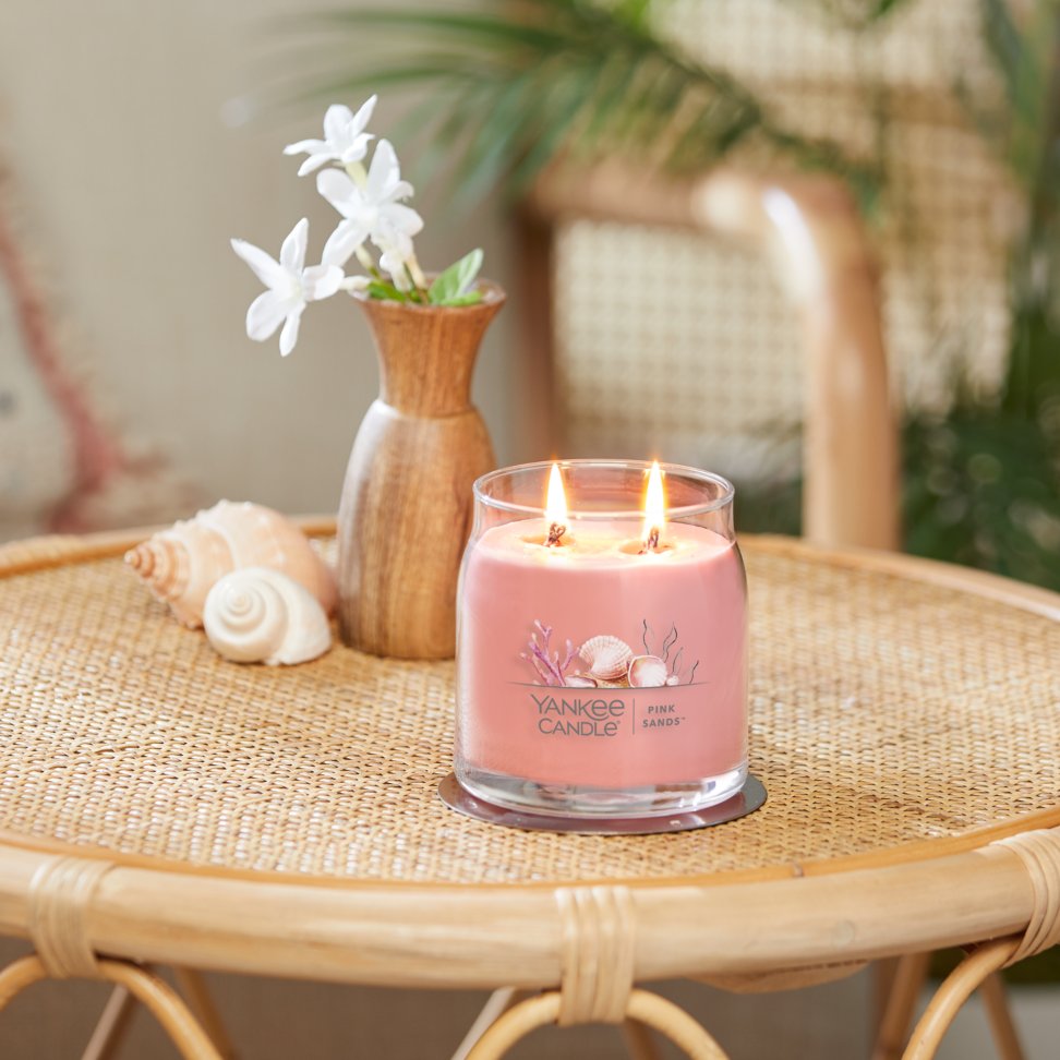 pink sands signature medium tumbler candle on table