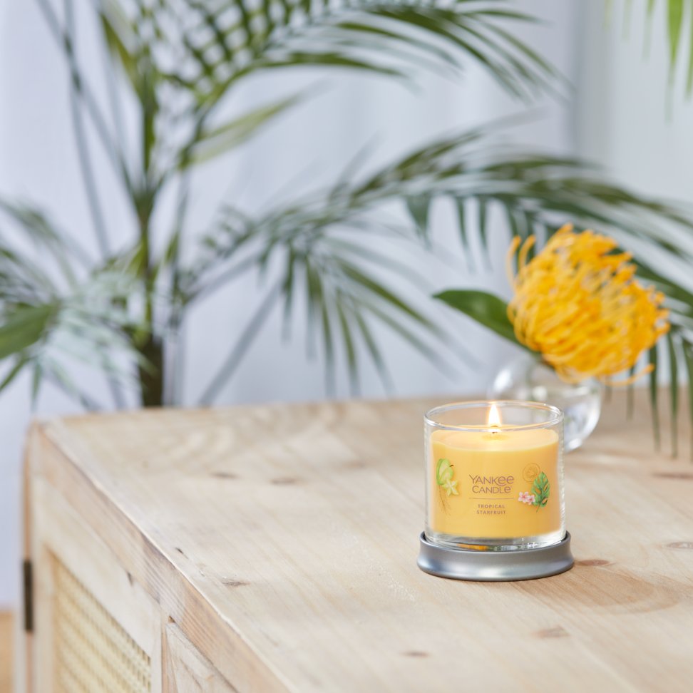 tropical starfruit signature small tumbler candle on table
