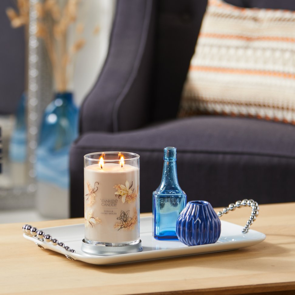 vanilla creme brulee signature large tumbler candle with two vases on coffee table