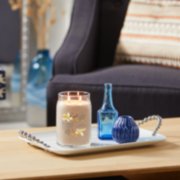 vanilla creme brulee signature large jar candle on coffee table image number 4