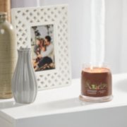praline and birch signature medium jar candle on table image number 4