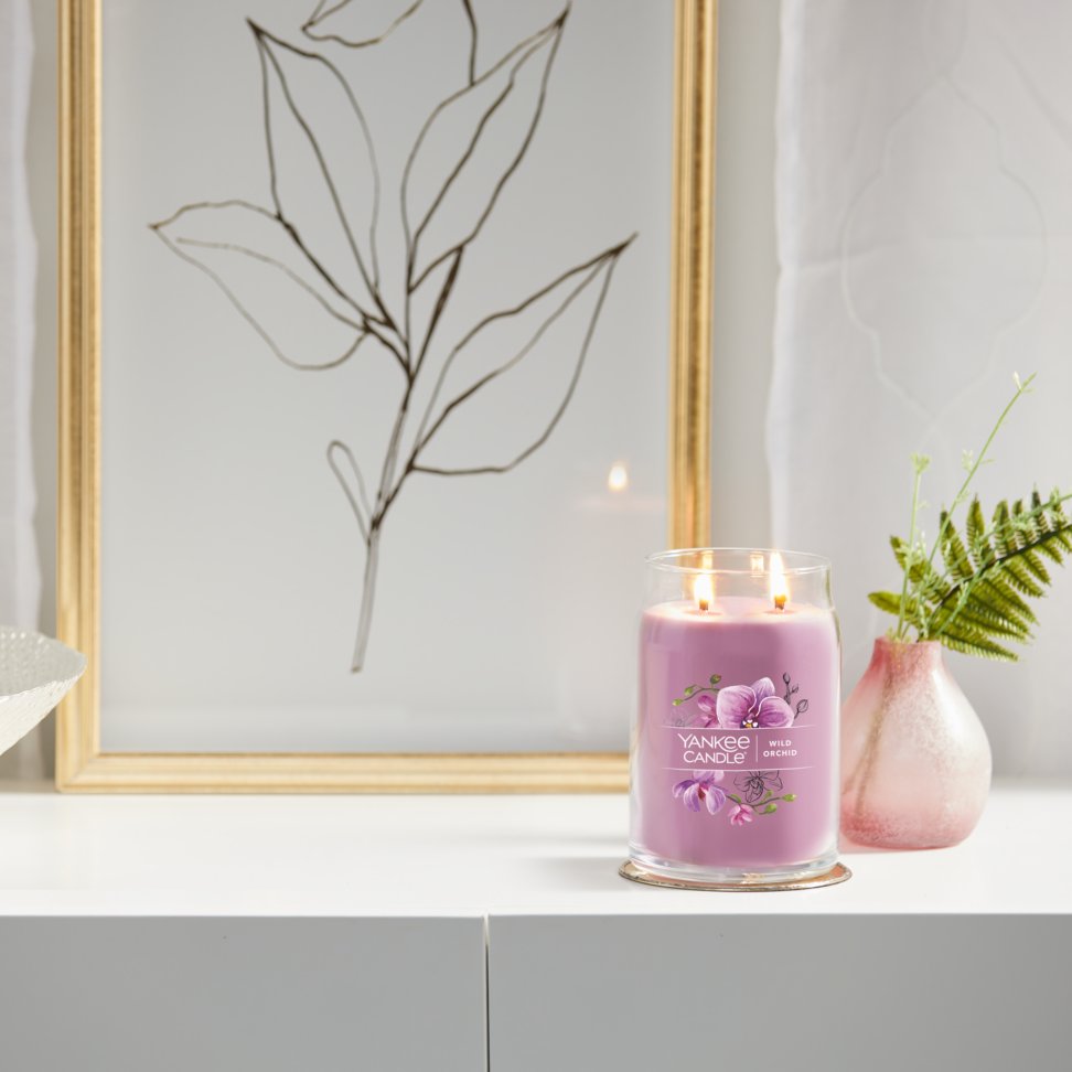 wild orchid signature large jar candle on table