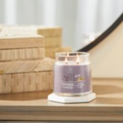 dried lavender and oak signature medium jar candle on table image number 4