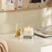 midnight jasmine signature small tumbler candle on desk image number 4