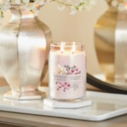 pink cherry and vanilla signature large jar candle on table image number 5
