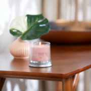 fresh cut roses signature small tumbler candle lit on side table image number 3