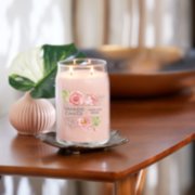 fresh cut roses signature large jar candle lit on side table image number 4