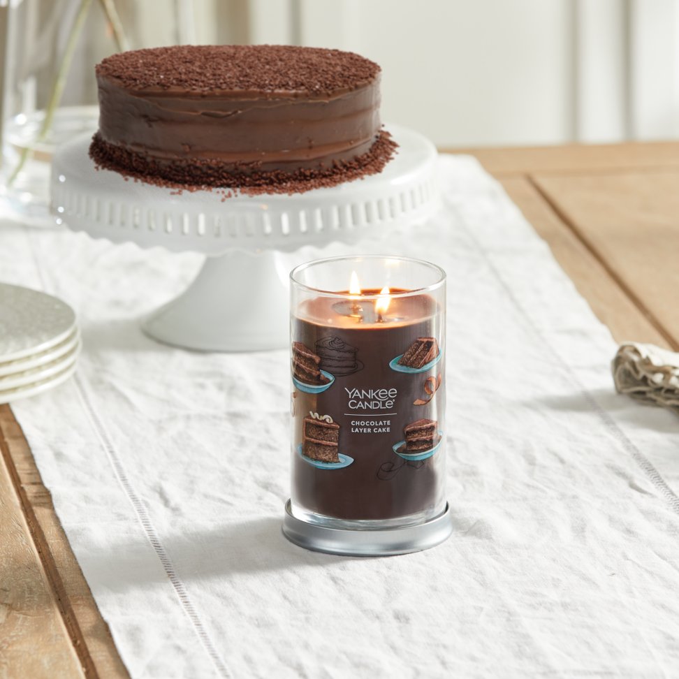 chocolate layer cake signature large tumbler candle on table