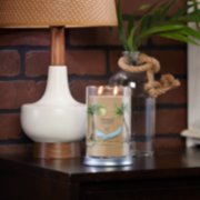 sun and sand signature large tumbler candle on table image number 3