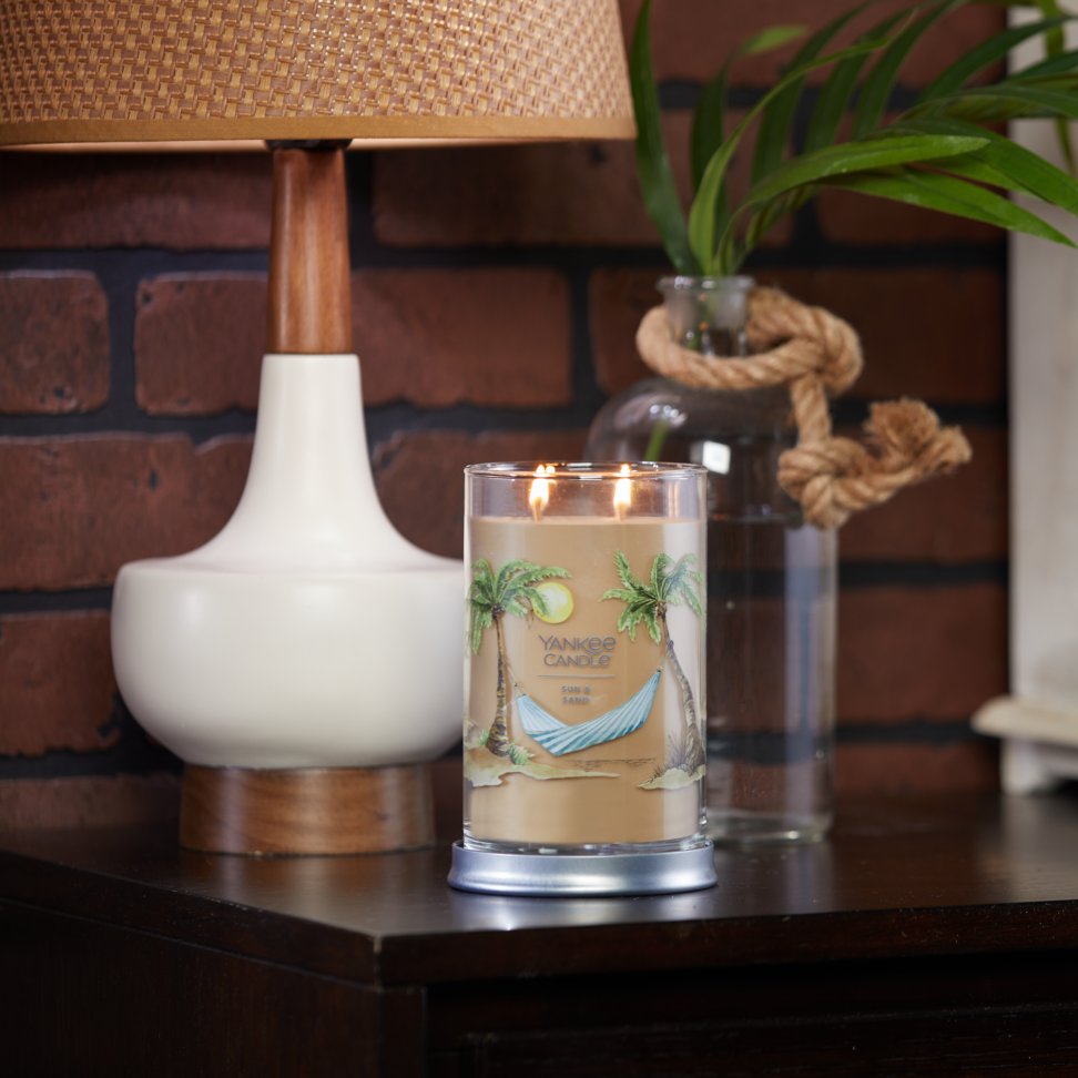 sun and sand signature large tumbler candle on table