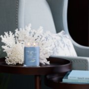 life's a breeze signature large jar candle on table in living room image number 3