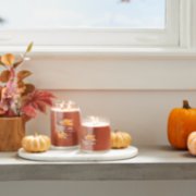 spiced pumpkin signature large and medium jar candles on table image number 4