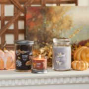 cozy cabin escape signature large tumbler candle, spiced pumpkin signature small tumbler candle, and smoked vanilla and cashmere signature large jar candle on mantle image number 7