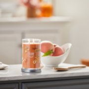 farm fresh peach signature large tumbler candle on kitchen counter image number 4