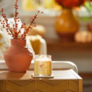 sunlit autumn signature medium jar candle on table image number 4