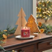 red apple wreath signature medium jar candle on desk image number 6