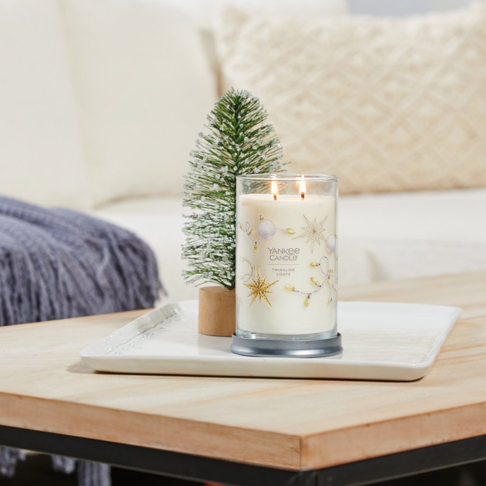 twinkling lights signature large tumbler candle on table