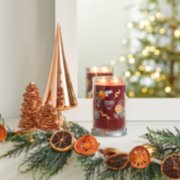 holiday zest signature large tumbler candle on mantle image number 6