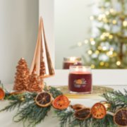 holiday zest signature medium jar candle on mantle image number 6