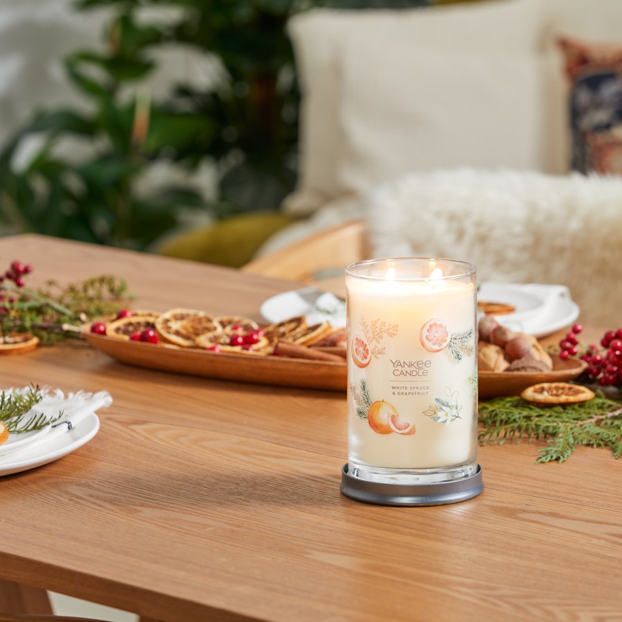 white spruce and grapefruit signature large tumbler candle on table