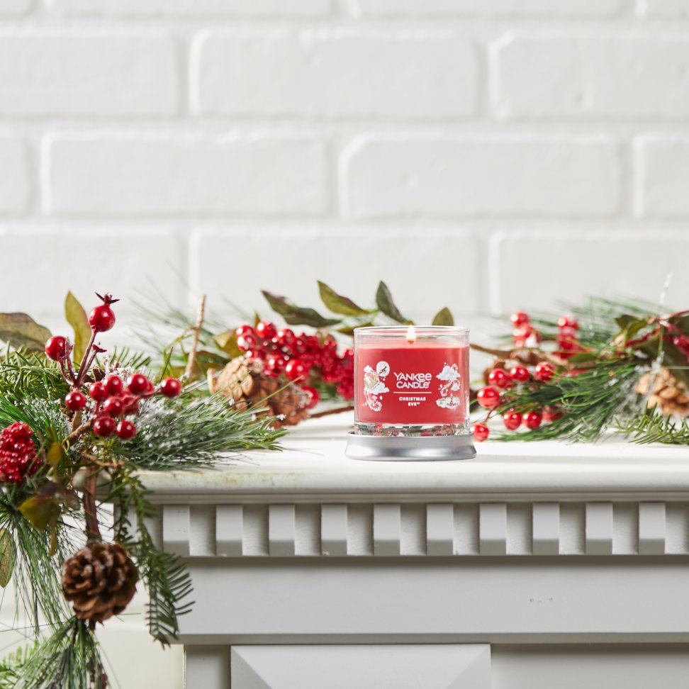 christmas eve signature small tumbler candle on mantle