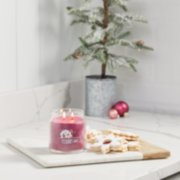 merry berry signature medium jar candle on counter image number 4