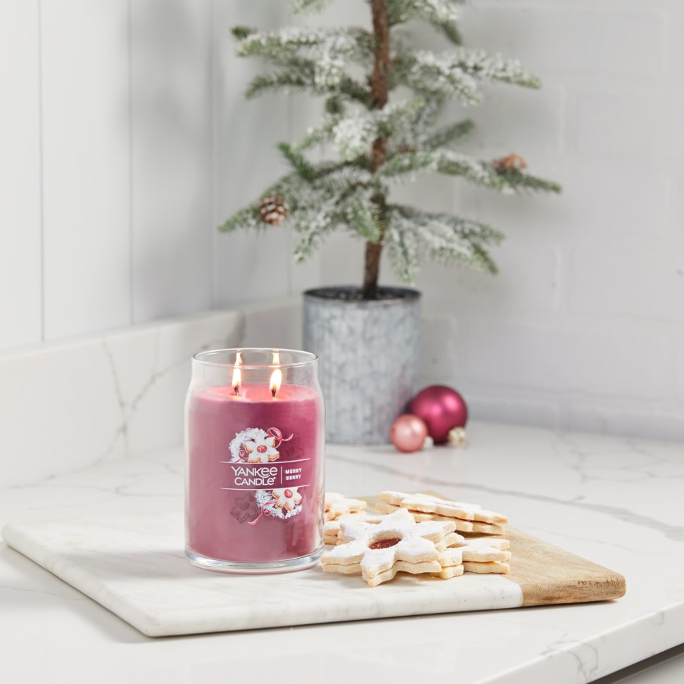 merry berry signature large jar candle on counter