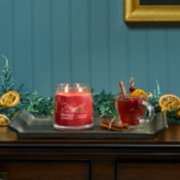 sparkling cinnamon signature medium jar candle on table image number 4