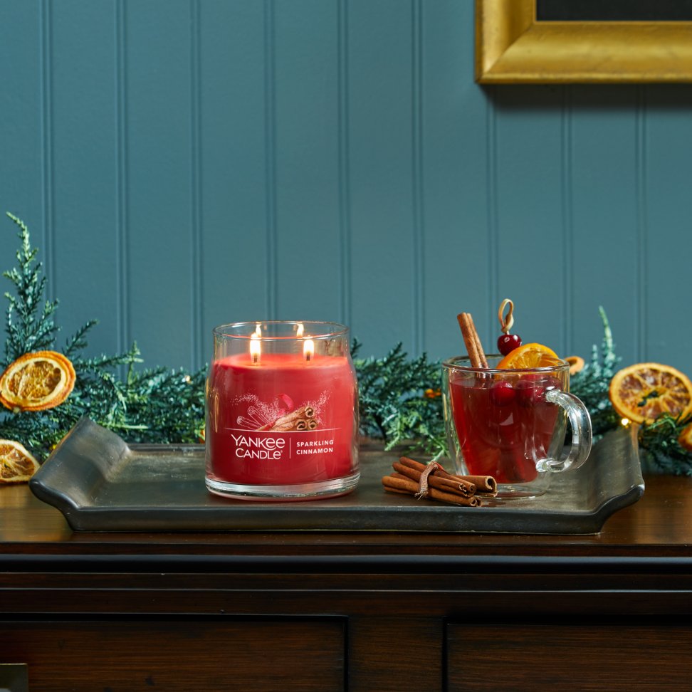 sparkling cinnamon signature medium jar candle on table