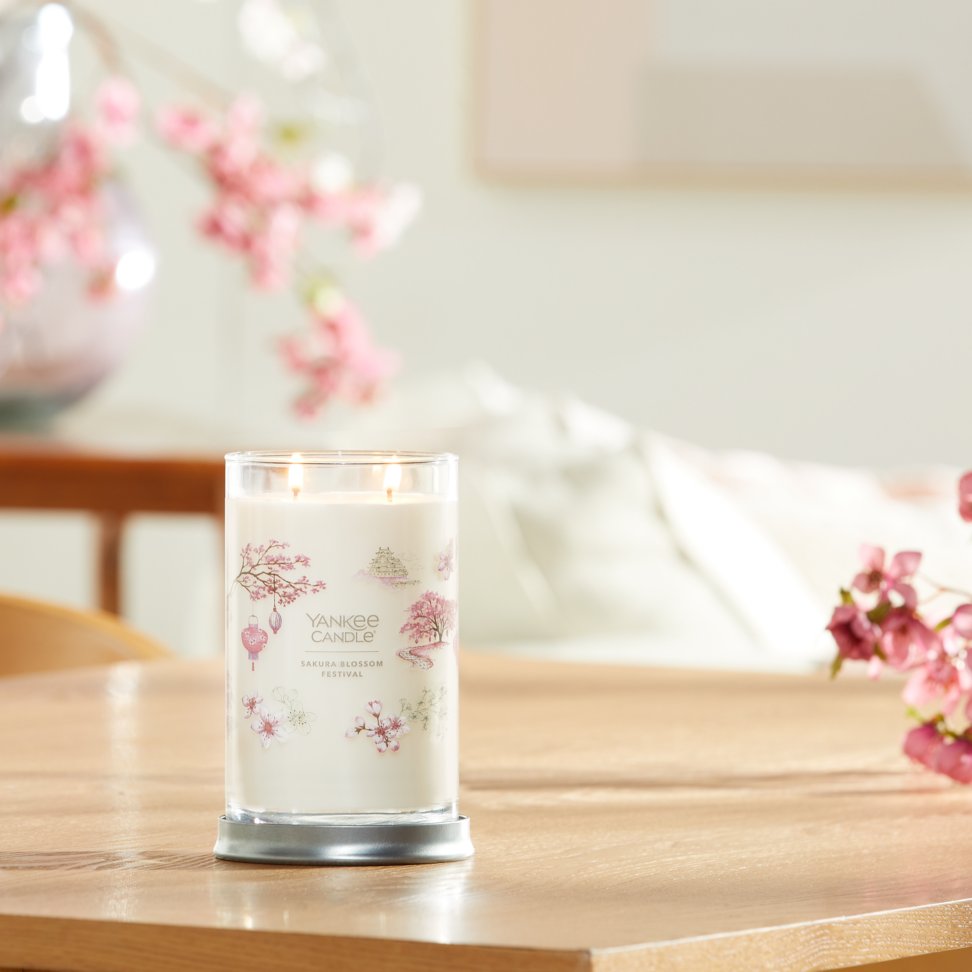 sakura blossom festival signature large tumbler candle on living room table