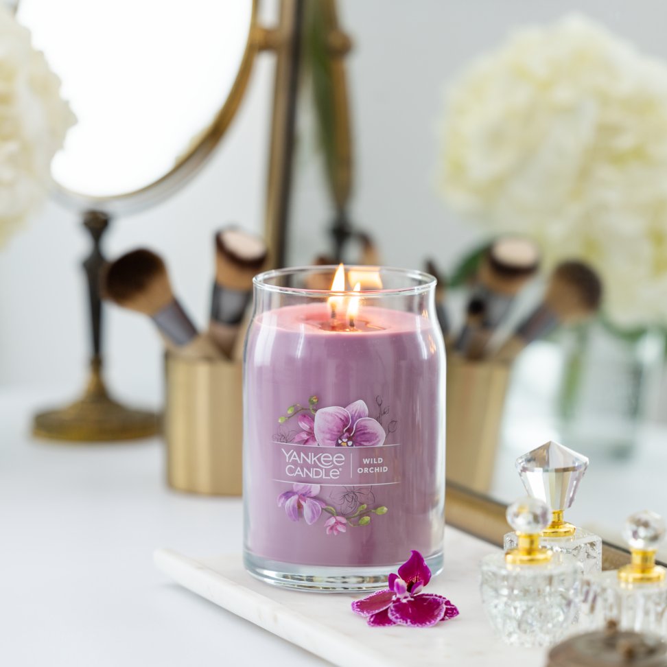 wild orchid signature large jar candle on vanity