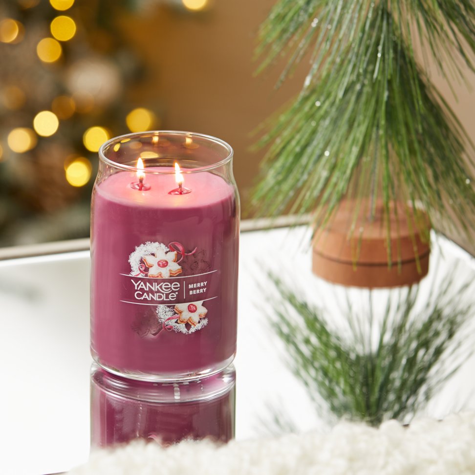 merry berry signature large jar candle on table