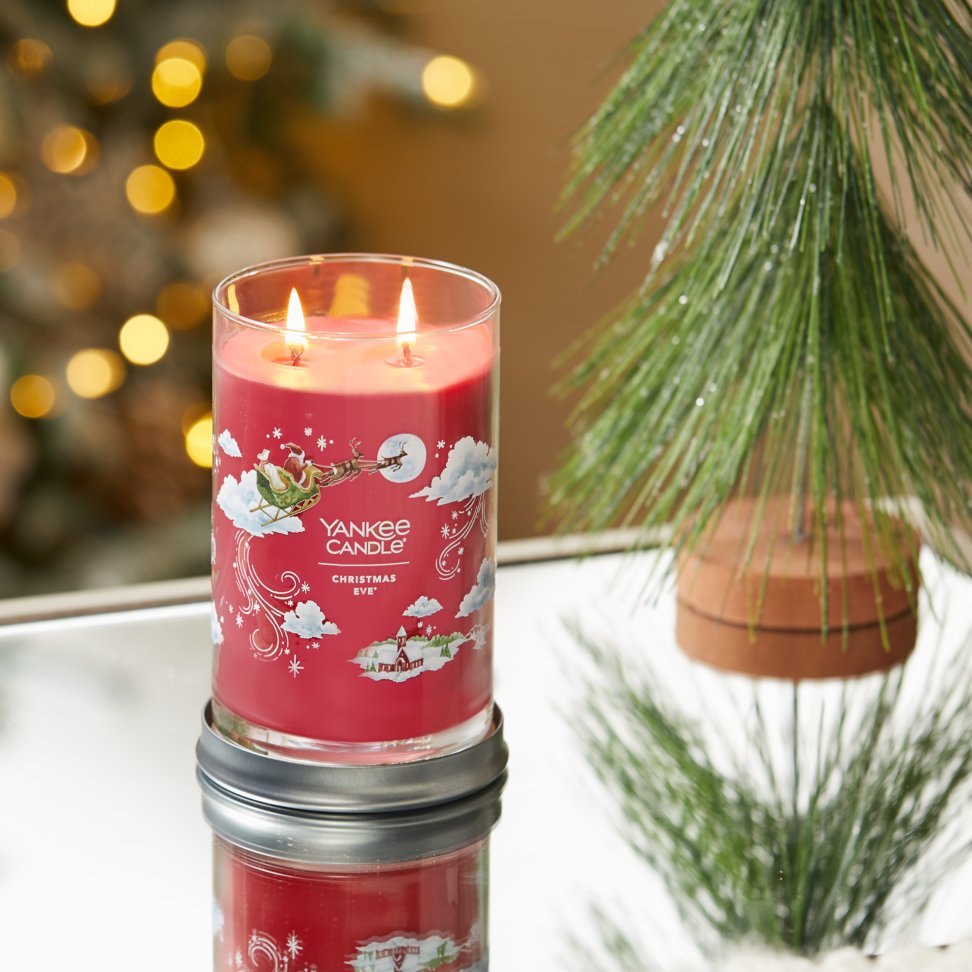 christmas eve signature large tumbler candle on table